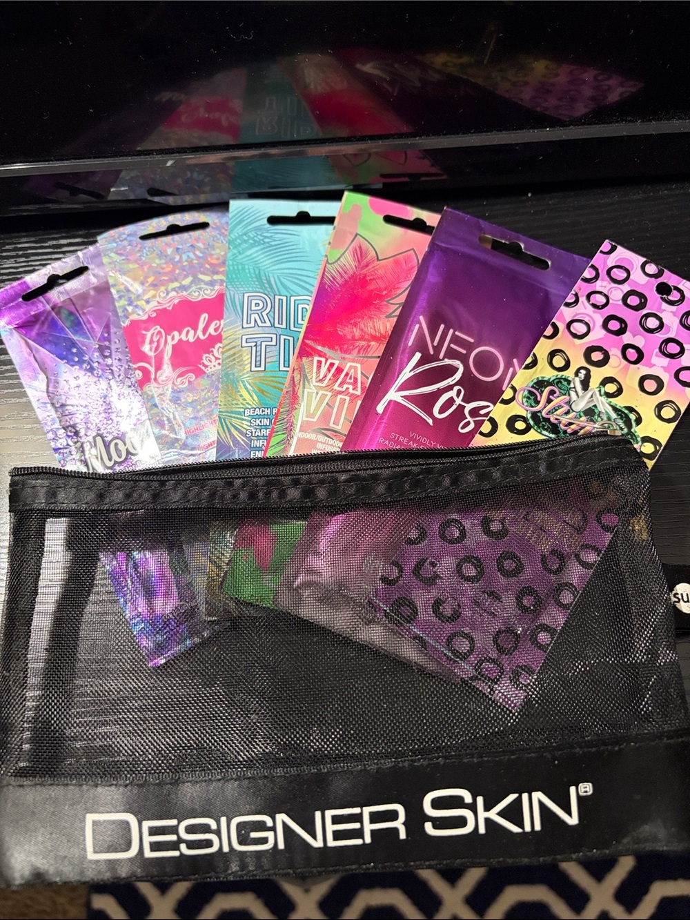 6 Designer Skin tanning bed lotion packets complete in a zip container pouch